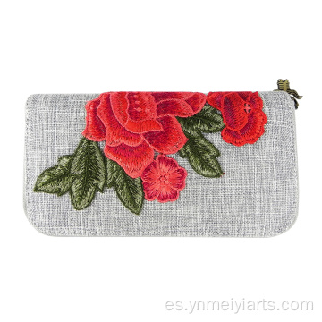 Cartera estilo lino con cremallera alrededor y bordado de peonías